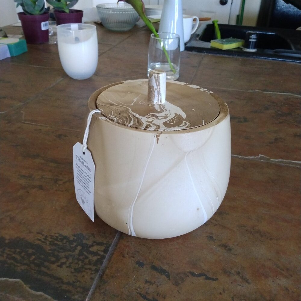 Tan and white lidded jar